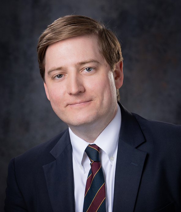 Headshot of C. Aron Vaughn.